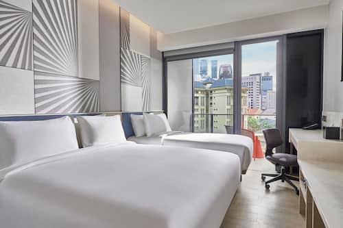 Deluxe Room, Multiple Beds, Balcony | Minibar, individually decorated, individually furnished, desk