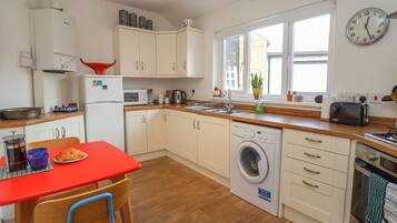 Fridge, electric kettle, toaster, cookware/dishes/utensils