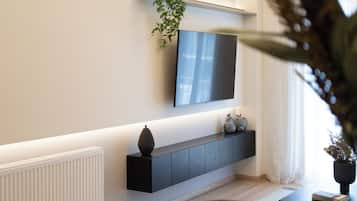 Appartement Ville | Coin séjour | TV connectée de 55 pouces avec chaînes par câble