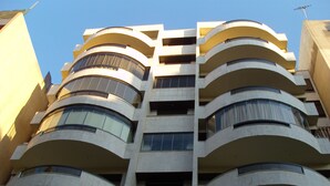 A multi-story building with balconies on each floor.