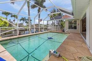 Outdoor pool, a heated pool - MAGNIFICENT! LUXURY WATERFRONT HOME;BIG HEATED POOL-80’ DOCK! 5 MIN FISH VILLAGE (Punta Gorda)
