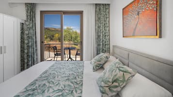 Habitación familiar | 1 habitación, artículos del minibar gratis y ropa de cama