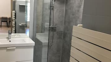 Shower, hair dryer, towels, toilet paper