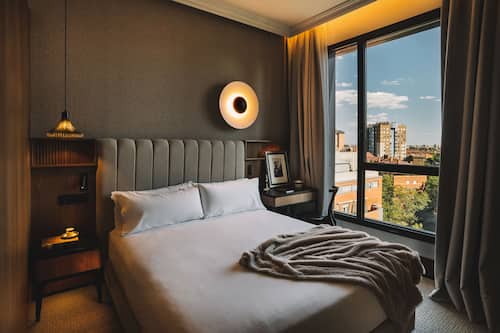 Deluxe Double Room | Minibar, in-room safe, desk, blackout drapes