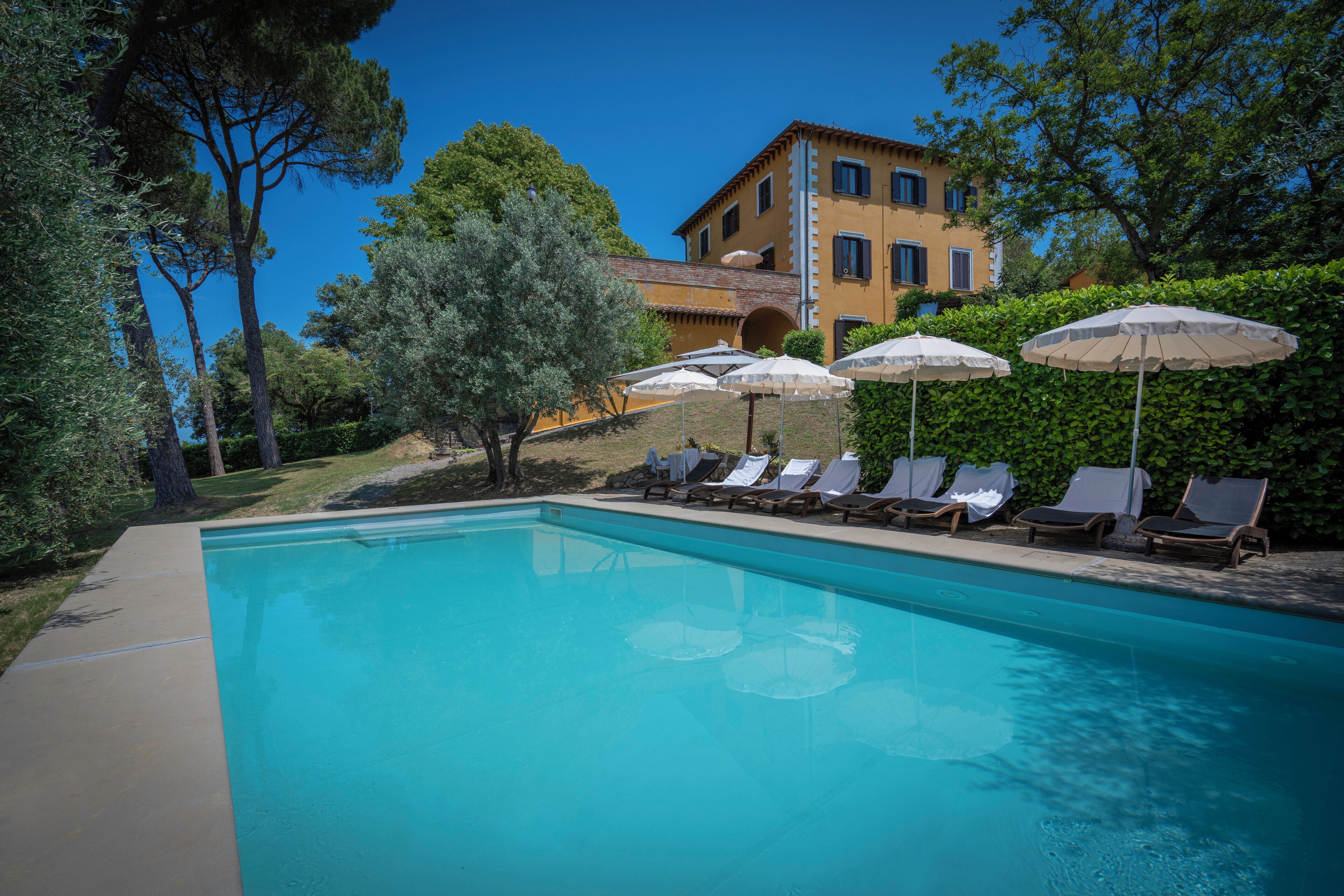 Seasonal outdoor pool, pool umbrellas, pool loungers