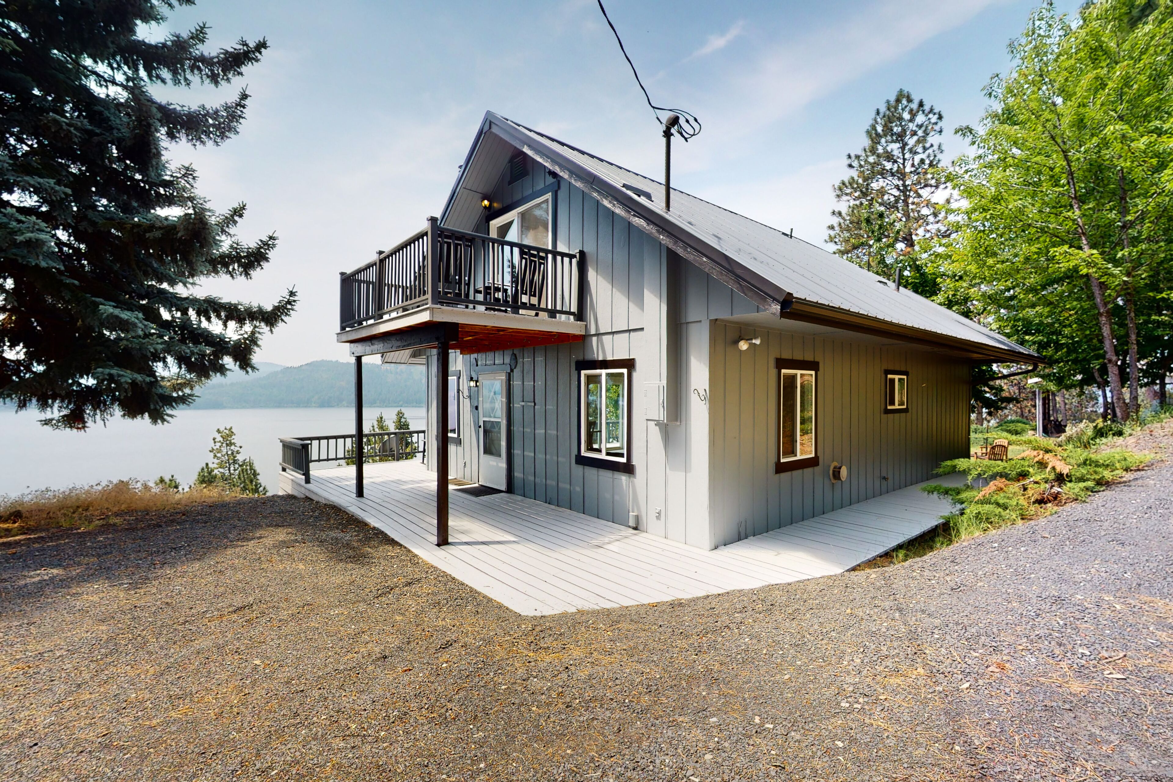 Amazing lake-view cabin with balcony, firepit, grill, wood stove, & W/D