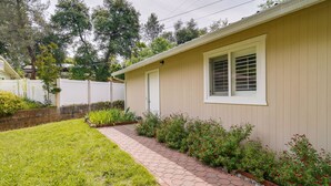 A single-story house with a paved walkway leading to the front door. - Sunny California Retreat w/ Pool Access & Patio! (Shasta Lake)