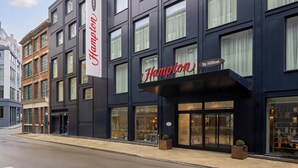 A modern hotel with a prominent 'Hampton by Hilton' sign, large windows, and a clean facade. - Hampton by Hilton London Old Street (London)