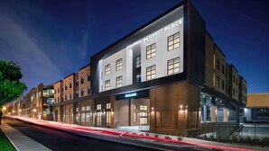 A modern hotel building with a "HYATT PLACE" sign, a parking entrance, and a well-lit facade. - Hyatt Place Nashville Green Hills (Nashville)