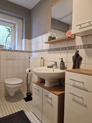 Bathtub, hair dryer, towels