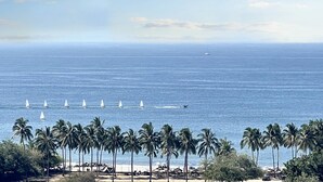 A beach with palm trees and a clear view of the ocean. - Beautiful Condo with Private Beach Club (Cruz de Huanacaxtle)