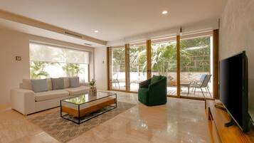 Condo | Living room | 50-inch Smart TV with digital channels, TV, streaming services