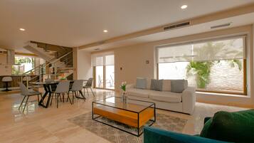 Condo | Living room | 50-inch Smart TV with digital channels, TV, streaming services