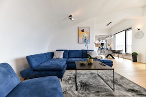 Deluxe Apartment | Living area | 100-cm Smart TV with digital channels, TV