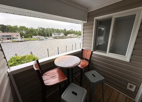 Outdoor dining. Knot Three- Balcony View of ICW- Dog Friendly!