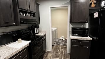 Coffee/tea maker, fridge, microwave, oven