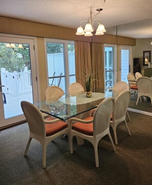 Enjoy meals in this dining area with a glass-top table and six comfortable chairs.