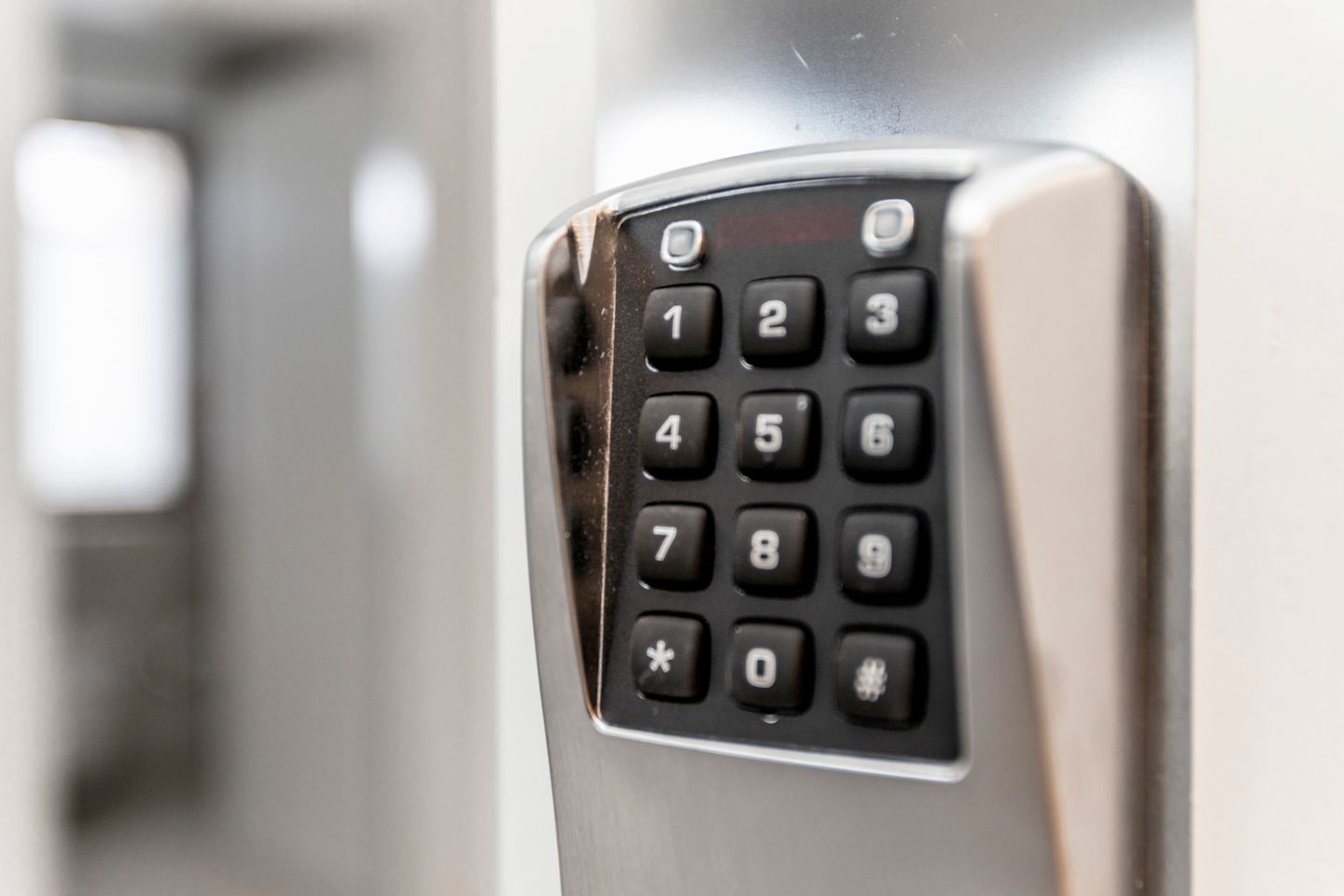 A close-up of a keypad with numbers 0-9 and symbols.