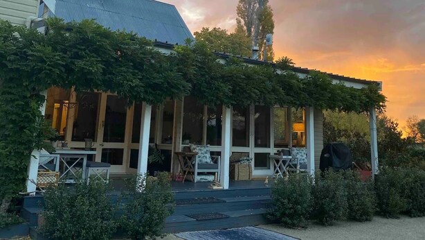 A house with a covered porch, a chimney, and a satellite dish. - The Convent O”Connell Circa 1867 cosy, charming, character filled retreat (O'Connell)