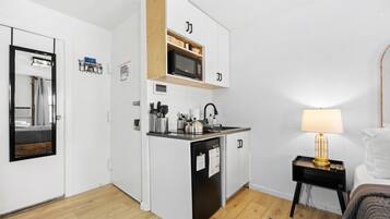 Fridge, microwave, stovetop, coffee/tea maker