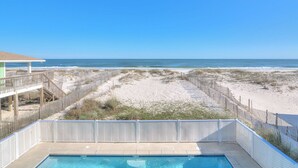 A pool area with a view of the beach and ocean. - Sea Monster, West. Big. Beachfront. Pool. Sleeps 26. Awesome location! (Gulf Shores)