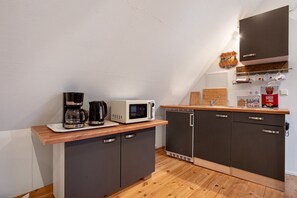 Fridge, microwave, stovetop, coffee/tea maker
