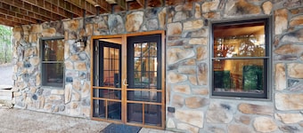 Log cabin in forested setting with private hot tub & amazing views, dog-friendly
