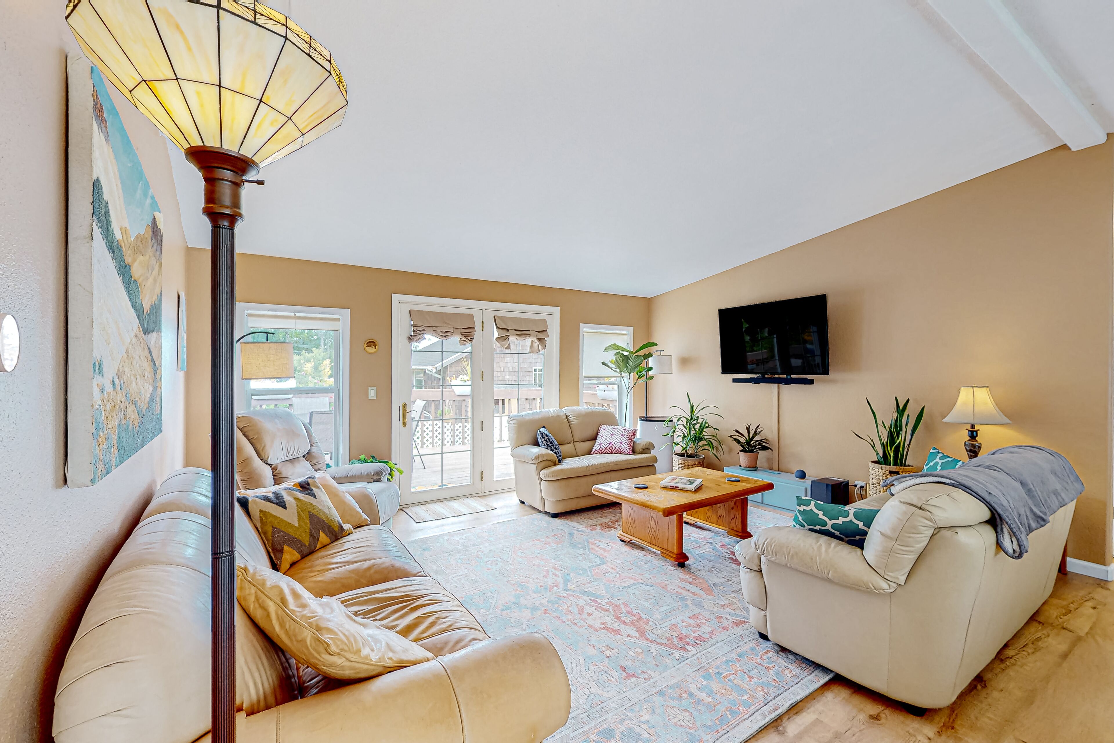 Dog-friendly home with enclosed yard, outdoor areas, & private washer/dryer