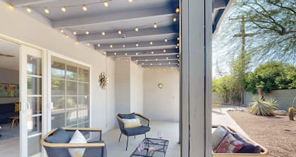 Sun-soaked oasis with a pool, covered patio, grill, modern interior, W/D, & AC