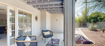 Sun-soaked oasis with a pool, covered patio, grill, modern interior, W/D, & AC