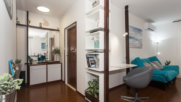 A modern living room with a sofa, a chair, a coffee table, and a bookshelf. - Top Location Beach & Downtown Split Apartment Park (Split)