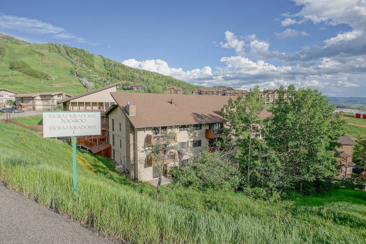 A residential area with a sign for 'Storm Meadows' indicating a possible lodging facility.