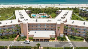 A hotel with a pool, beach view, and multiple balconies. - Amazing Ocean and Pool Views! Balcony, Elevator, Minutes to Historic Downtown, $300 in Free Tickets! (St. Augustine)