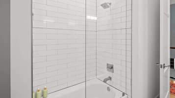 Bathtub, hair dryer, towels, shampoo