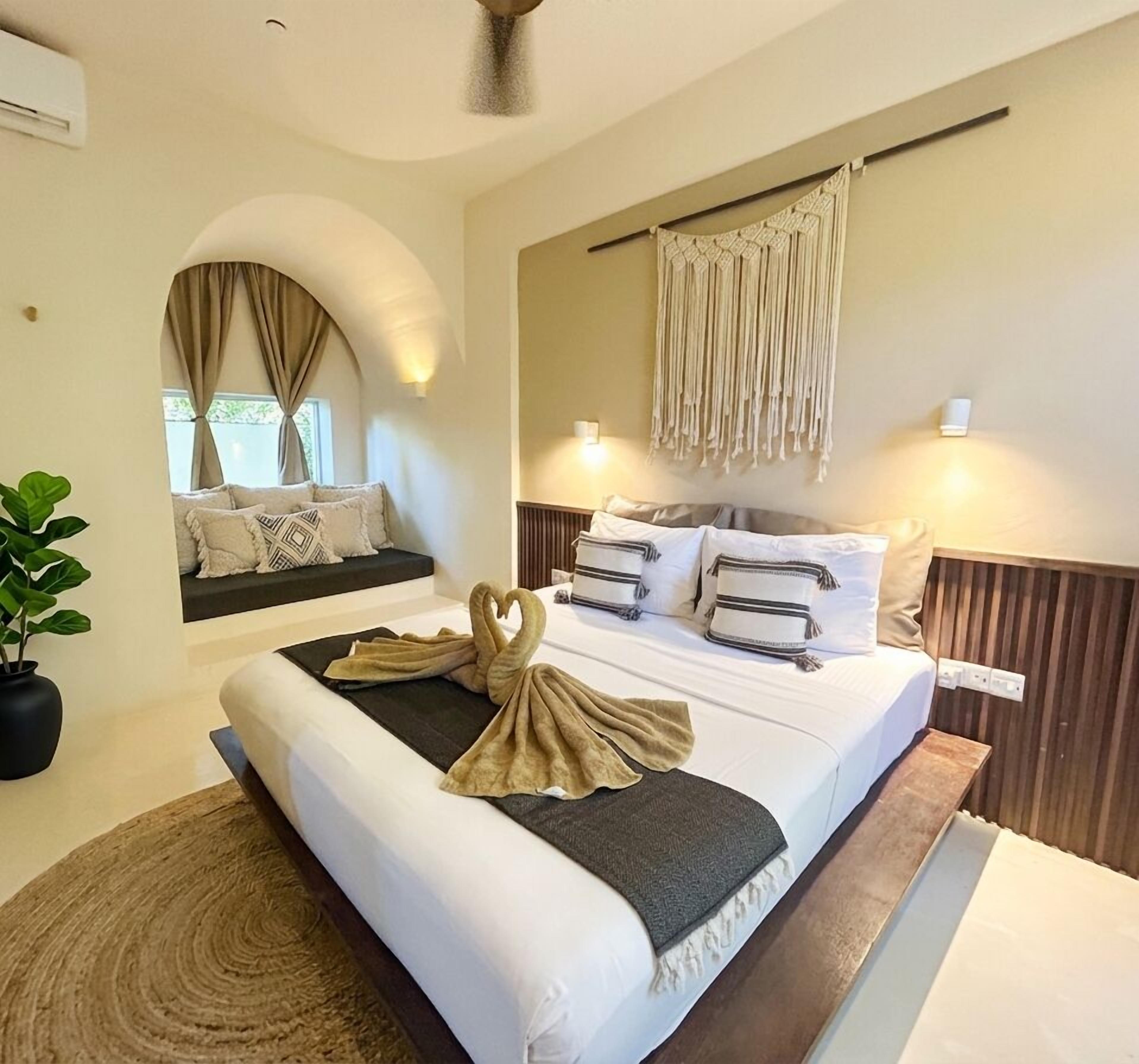 Apartamento família | Frigobar, cofres nos quartos, individualmente decorados