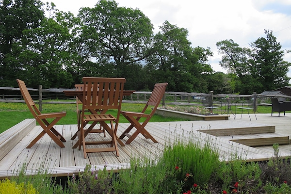 Rear decked area with outdoor furniture. Shared area with home owners.