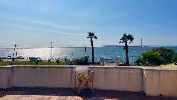 A terrace with a view of the sea, a chair, and a fence. - 4 Bedroom Villa in Marsala (Marsala)