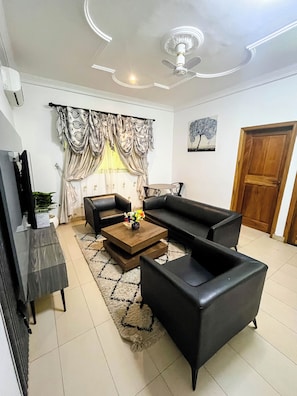 Junior Suite, 1 King Bed, Pool View | Living area | 42-inch Smart TV with satellite channels - RK Italian Boy Hotel (Accra)