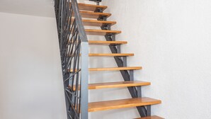 A spiral staircase with wooden steps and a metal railing. - Lucio suites - Apartment 3 with balcony (Split)