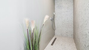 A modern shower with a handheld showerhead and a wall-mounted faucet. - Lucio suites - Apartment 3 with balcony (Split)