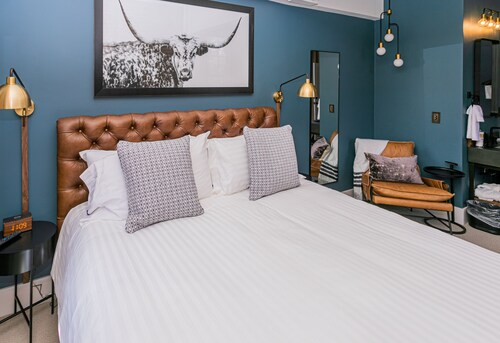 Jacksonville Inn Room #8: King Suite. Prime downtown location for festivals and dining. Comfortable king bed, Nespresso coffee, and historic boutique elegance