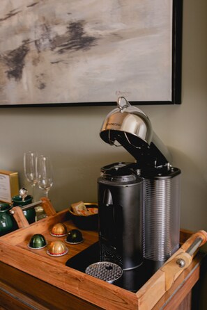 A coffee machine with a lid, a tray with glasses and a teapot, and a wooden tray. - Experience charming Jacksonville, OR in this 8-bedroom Historic Inn. Enjoy a wine country getaway with 8 private bedrooms. Walk to dining, shopping, and the famed Britt Festival grounds. (Jacksonville)