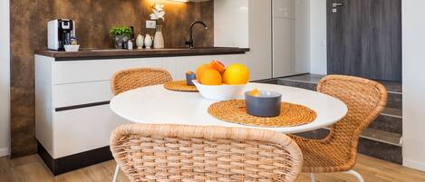 Fridge, microwave, coffee/tea maker, cookware/dishes/utensils