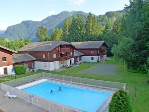 Relax on the balcony or by the pool, surrounded by lush greenery and majestic mountains.