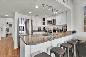 Fridge, microwave, oven, stovetop - 738 Surf Condo - Oceanfront - Pool access (Surf City)