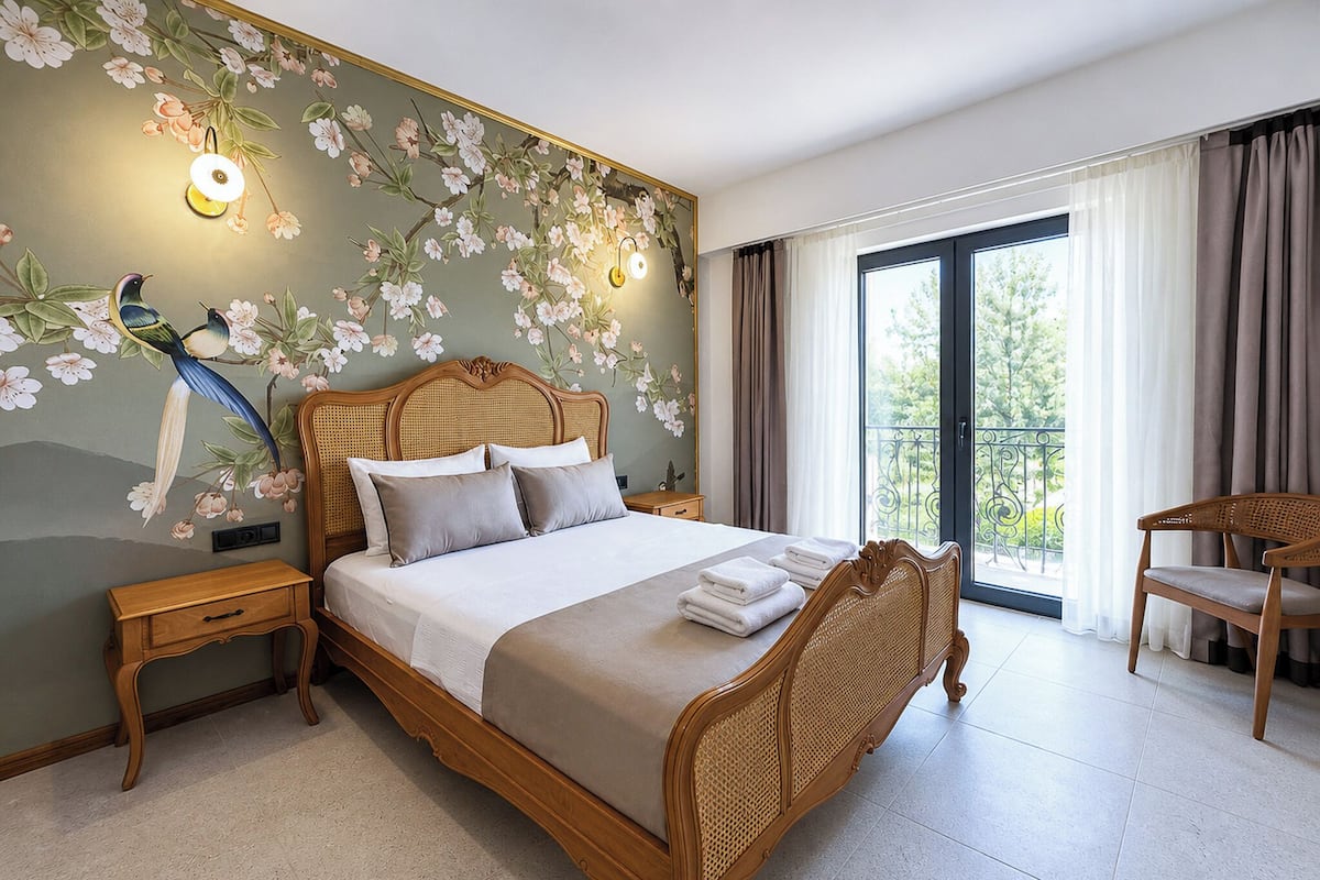 Suite Deluxe, varias habitaciones, balcón | Ropa de cama de alta calidad, colchones con acolchado adicional, minibar