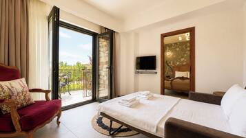 Suite Deluxe, varias habitaciones, balcón | Ropa de cama de alta calidad, camas con pillow-top y minibar