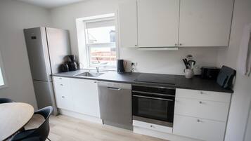 Apartment | Private kitchen | Full-size fridge, microwave, oven, stovetop