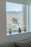 Apartment | Living area | 40-inch flat-screen TV with satellite channels, heated floors