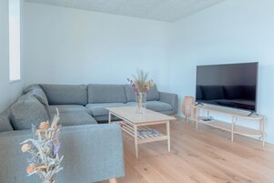 Apartment | Living room | 40-inch flat-screen TV with satellite channels, heated floors